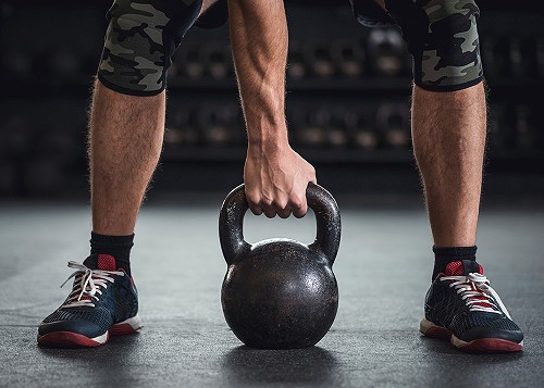 A man using a kettle bell
