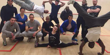 A group of personal trainers in gymnastic positions