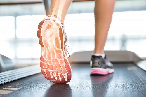 A gym user running on a treadmill
